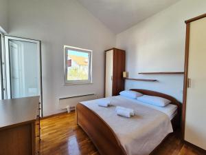 Postel nebo postele na pokoji v ubytování Villa Sucic Razanj