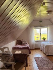 Postel nebo postele na pokoji v ubytování Rävåkra B&B Österlen