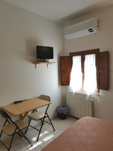 TV a/nebo společenská místnost v ubytování Camere la torre