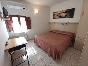 Postel nebo postele na pokoji v ubytování Camere la torre