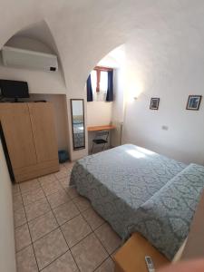 Postel nebo postele na pokoji v ubytování Camere la torre