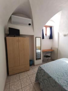 Postel nebo postele na pokoji v ubytování Camere la torre