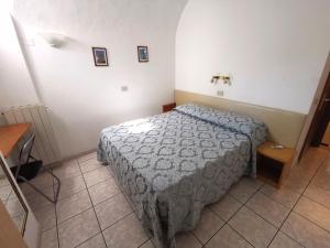 Postel nebo postele na pokoji v ubytování Camere la torre