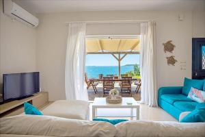a living room with a view of the ocean at Endless Seaview Villa in Argostoli