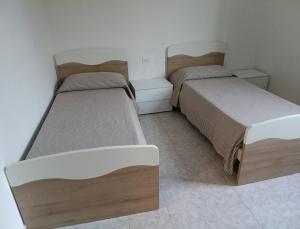 Ένα ή περισσότερα κρεβάτια σε δωμάτιο στο Casa Vacanze Azzurra