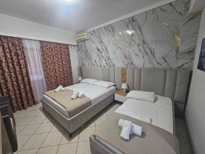 Postel nebo postele na pokoji v ubytování Hotel Pini