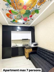 a kitchen with a painting on the ceiling at Luxs Apartments in Tashkent with kitchen for 8-10persons ул Шоший64 in Tashkent