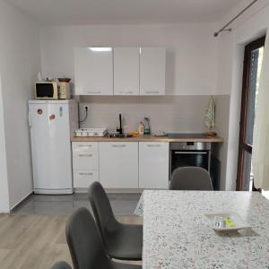 Kuchyň nebo kuchyňský kout v ubytování Mondeno apartments