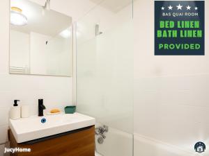 a bathroom with a white sink and a mirror at Le 44 Saint-Louis in Boulogne-sur-Mer +35 photos