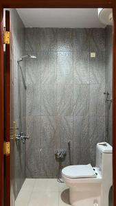 a bathroom with a shower and a toilet in it at استديو جديد in Hail