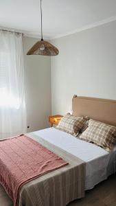 Ένα ή περισσότερα κρεβάτια σε δωμάτιο στο Apartamento Mar de Cruz