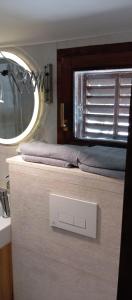 a bedroom with a bed with a window and a sink at Jamm Mare e Monti Tiny house in Orebić +31 photos
