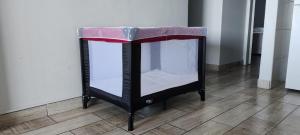 a room with a bed with a red top at Durban Beachfront Bliss in Durban