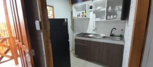 a kitchen with a sink and a counter top at Cabaña Barbacoas1 in Santa Ana +16 photos