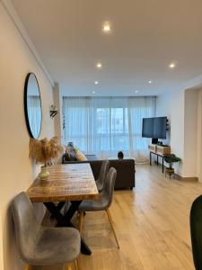 TV a/nebo společenská místnost v ubytování Apartamento Arena