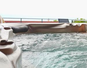 a person laying in a pool of water at Villa Dilana in Balchik