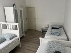 a bedroom with two bunk beds and a hallway at Ferien - Wohnung In Kassel Waldau Zentral in Kassel