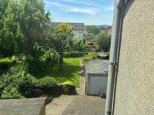 a view of a yard from a window at Ferien - Wohnung In Kassel Waldau Zentral in Kassel