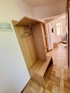 a stairwell in a house with a wooden stair case at Róża Wiatrów in Sztutowo +25 photos