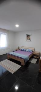 Postel nebo postele na pokoji v ubytování Apartman Kalina