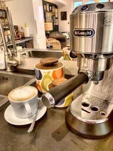 a coffee maker and a cup of coffee on a counter at Stunning 2 bed, 2 bath Summertown Oxford in Oxford