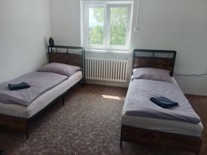 Postel nebo postele na pokoji v ubytování KEMP a stanování na faře