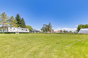 an rv parked in a field of grass at Modern Bloomington Home about 10 Mi to Bear Lake! in Bloomington