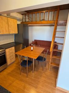 a kitchen and dining room with a table and chairs at PARADISE SEA HOUSE a in Haraki