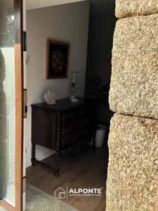 a door leading into a room with a table at Casa das Nogueiras By ALPONTE in Mazedo +16 photos