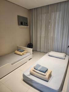Ένα ή περισσότερα κρεβάτια σε δωμάτιο στο AP aconchegante próx ao Aeroporto