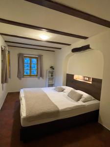 a bedroom with a large bed in a room at Apartment Abinkar in Tolmin +171 photos