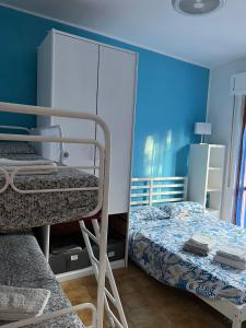 Posteľ alebo postele v izbe v ubytovaní Piccola Casa Mucchiola 600mt dalla Spiaggia + 15 fotografií