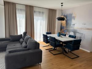 a living room with a couch and a table at HORIZON Privlaka3 in Privlaka