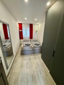 A bed or beds in a room at Korona Apartman Balatonboglár