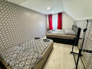 A bed or beds in a room at Korona Apartman Balatonboglár
