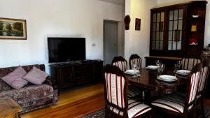 a living room with a table and a couch at Balkan Vibe Apartments in Žabljak