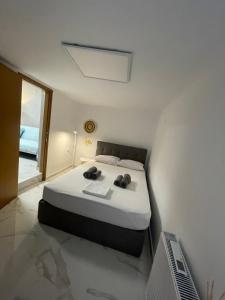 a bedroom with a bed and a window at The Secret Studio - OAKA Stadium & nearby hospitals in Athens