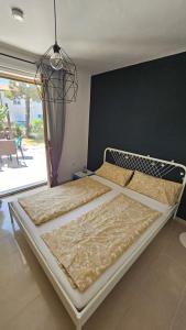 Ένα ή περισσότερα κρεβάτια σε δωμάτιο στο Vacation home with garden +21 φωτογραφίες