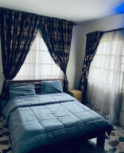 Postel nebo postele na pokoji v ubytování Uno One Airport Inn + 9 fotografií