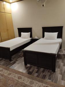 Highland Club Balakot客房内的一张或多张床位