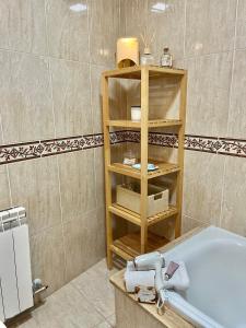 a bathroom with a sink and a bath tub at Ático las Palmeras in Caldas de Reis