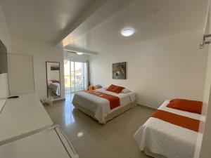 Ένα ή περισσότερα κρεβάτια σε δωμάτιο στο Hotel Santa Fe