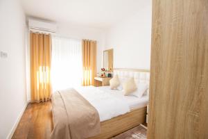 Ένα ή περισσότερα κρεβάτια σε δωμάτιο στο Apartment Numa - Ulcinj