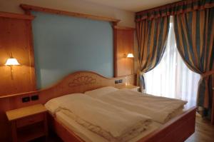 Postel nebo postele na pokoji v ubytování Garnì Costa Verde