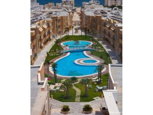 an aerial view of a resort with a swimming pool at New 2-room secure residence, beach, pool in Port El Kantaoui