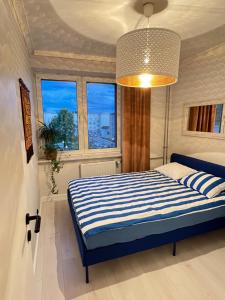 Postel nebo postele na pokoji v ubytování Apartament Rockabilly