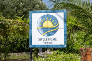 a sign for a sweet home pahump at Sweet home Palinuro in Palinuro +25 photos