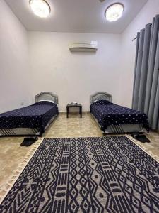Postel nebo postele na pokoji v ubytování marhaba 1