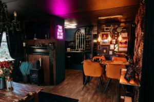 a dining room with a table and chairs at The Velvet Hideaway in Burnham on Sea +31 photos