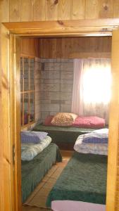 Postel nebo postele na pokoji v ubytování Tammekännu Holiday House